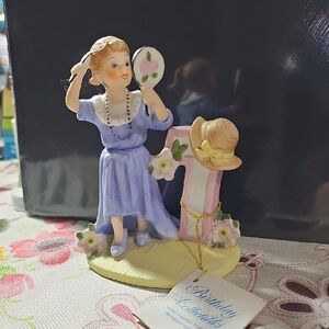 Charming Figurine with Mirror and Hat